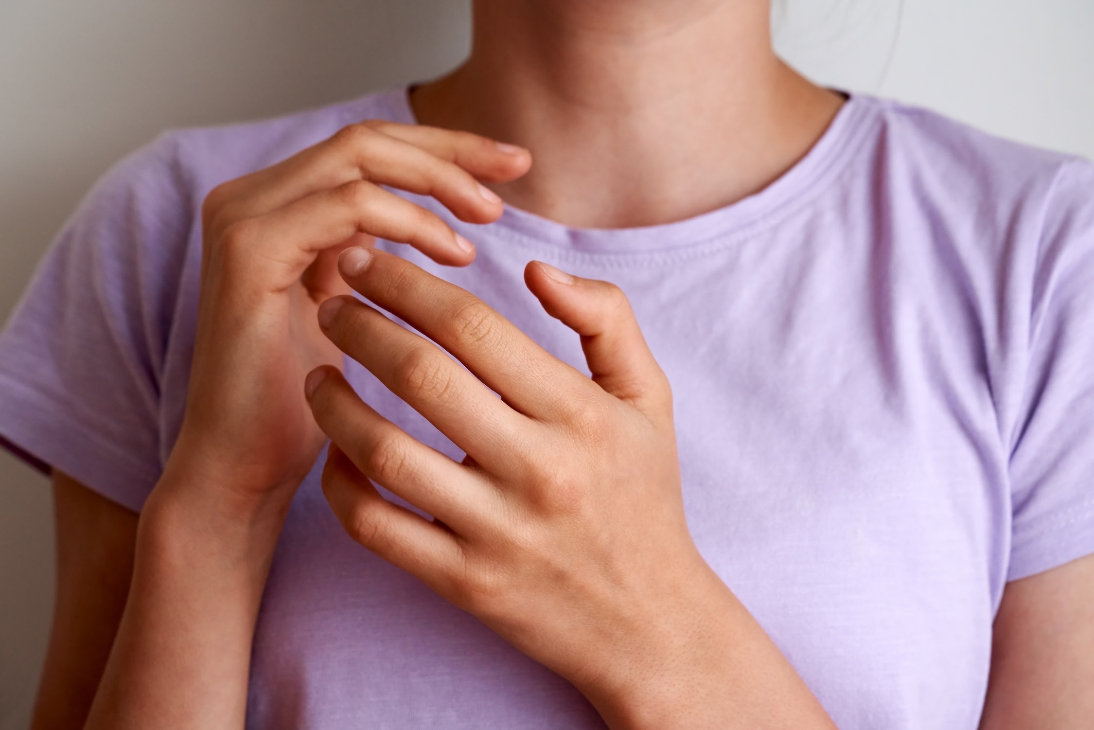 Teenage girl practicing EFT tapping or emotional freedom technique